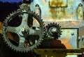 Vintage oily and rusty cogwheel at night