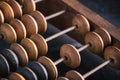Vintage old accounting wooden abacus. Close up. Toned image