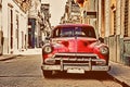 Vintage old american red car parked in a street of havana Royalty Free Stock Photo