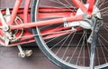 Old red bike on the background of a brown wooden wall Royalty Free Stock Photo