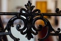 Vintage old black wrought-iron openwork railing staircase or fence. The fragment part. Forging, handmade. Palace Royalty Free Stock Photo