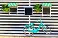 Vintage old blue bicycle near a store or bakery wall with white boards in a rustic style with chalkboard, signboards with Royalty Free Stock Photo