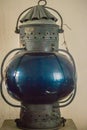 Vintage old blue submarine signal lamp, a visual signaling device for optical communication.