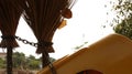 Vintage Old Brooms Chained with Yellow Plastic Chair