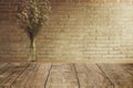 Vintage old brown brick wall with wooden table top foreground  space for advertising background Royalty Free Stock Photo