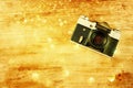 Vintage old camera on brown wooden background Royalty Free Stock Photo