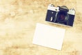 Vintage old camera and postcard.vintage filter. Royalty Free Stock Photo
