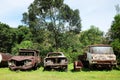 Vintage Old car, dirty truck, tractor and motorshed and Motorbike rustic at shed in junkyard. Defective equipment in the park of