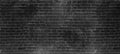 Vintage old dark black wash brick wall texture. Panoramic background for your text or image