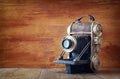 Vintage old decorative camera on brown wooden background. room for text. Royalty Free Stock Photo