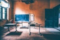 Vintage old destroyed classroom inside abandoned school with chalk board Royalty Free Stock Photo