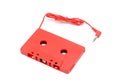 Red audio tape cassette adapter, isolated on white. Royalty Free Stock Photo