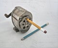 VINTAGE: Old-fashioned Pencil sharpener and two pencils.