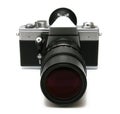 Vintage old film camera with tele lens Royalty Free Stock Photo