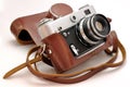 Vintage old film photo-camera in leather case