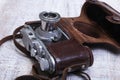 Vintage old film photo-camera in leather case Royalty Free Stock Photo