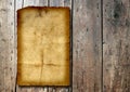 Vintage old grungy paper banner over ancient wood background