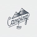 Vintage old logo or badge, label engraved and old hand drawn style with lettering camping and mountains