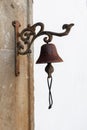 Vintage old metal bell hang on stone arch Royalty Free Stock Photo