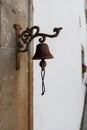 Vintage old metal bell hang on stone arch Royalty Free Stock Photo