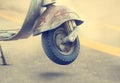 Vintage old motorcycle detail on street background Royalty Free Stock Photo