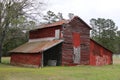 Vintage old red country farm barn grass field Royalty Free Stock Photo