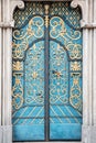 Vintage old blue door with a gold ornament Royalty Free Stock Photo