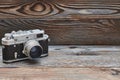 Vintage old retro rangefinder camera on wooden background Royalty Free Stock Photo