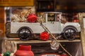 Vintage old rusty metal pick up truck model in rustic setting with Christmas ornaments against blurred background Royalty Free Stock Photo