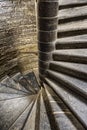 Vintage old spiral stone staircase in the style of grunge Royalty Free Stock Photo