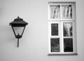 Vintage old street lamp hanging on the wall of a house with a window in St. Petersburg Royalty Free Stock Photo