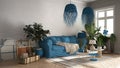 Vintage, old style living room in blue tones, Sofa, carpet, pillows and rattan pendant lamps, tables with decors and potted plants Royalty Free Stock Photo