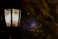 Vintage old style street light Lantern at night with Christmas decorations. Winter Holidays Tradition