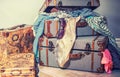 Vintage old suitcases crammed with clothes and sunglasses. Royalty Free Stock Photo