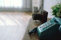 Vintage old telephone camera on wooden desk Royalty Free Stock Photo