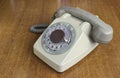 Vintage old telephone on wooden desk. technology of yesteryear Royalty Free Stock Photo