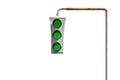 Vintage old traffic light on a rusty post. All lights are green. The concept of good luck and unhindered travel.