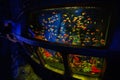 Vintage old underwater submarine with fishes inside at oceanarium exhibit