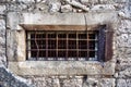 Vintage old window with lattice metal bars. Royalty Free Stock Photo