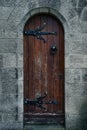 Vintage, old wooden door in Gothic style with iron hinge and frame in Glasnevin Cemetery, Ireland Royalty Free Stock Photo