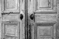 Vintage old wooden door with cracks background texture, peeling paint retro design black and white Royalty Free Stock Photo