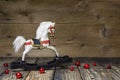 Vintage - old wooden rocking horse on a wooden old board for a c Royalty Free Stock Photo