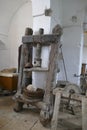 Vintage olive oil mill and grindstone