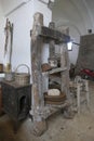 Vintage olive oil mill and grindstone