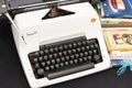 Vintage Olympia Arabic typewriter and used books. Royalty Free Stock Photo