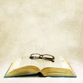 Vintage open book and classic eyeglasses