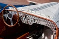vintage open-top car at the yacht show in Monaco on a sunny day, leather seats, spoked wheels, close-up Royalty Free Stock Photo