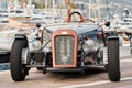 vintage open-top car at the yacht show in Monaco on a sunny day, leather seats, spoked wheels, close-up