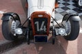 vintage open-top car at the yacht show in Monaco on a sunny day, leather seats, spoked wheels, close-up Royalty Free Stock Photo