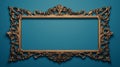 Vintage openwork bronze metal frame on a blue wall background, empty picture frame mockup